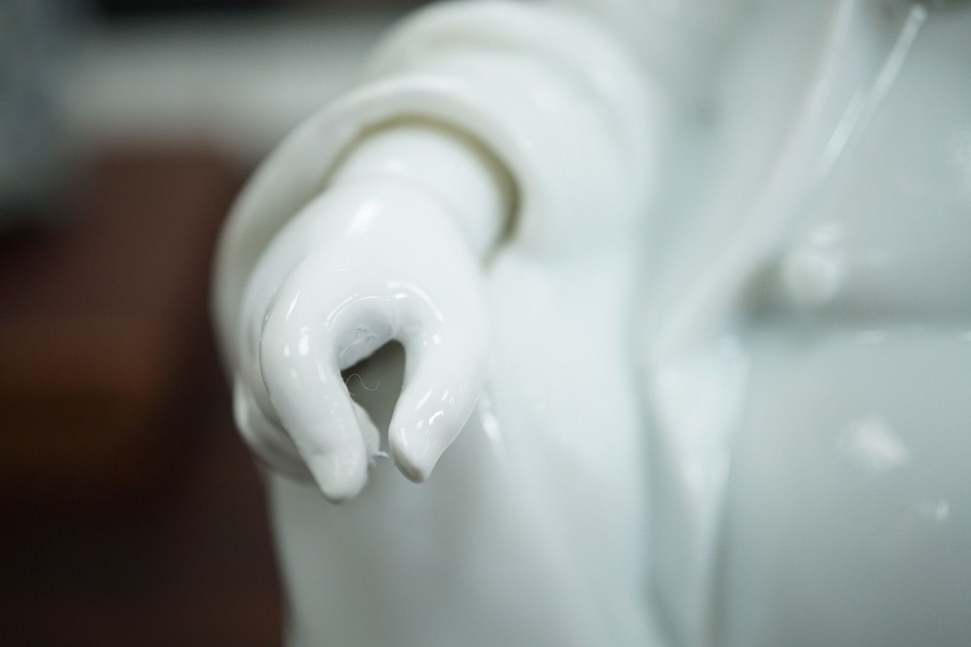 A Chinese blanc-de-chine seated figure of Budai, 18th/19th century